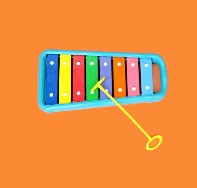 a toy with a colorful band of music on an orange background