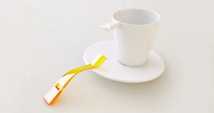 a coffee cup sits next to a yellow tie