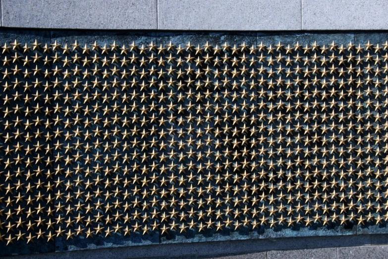 a very close up picture of a metal screen on a building