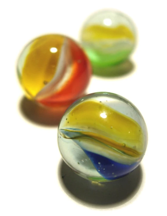 a pair of marbles with swirl designs