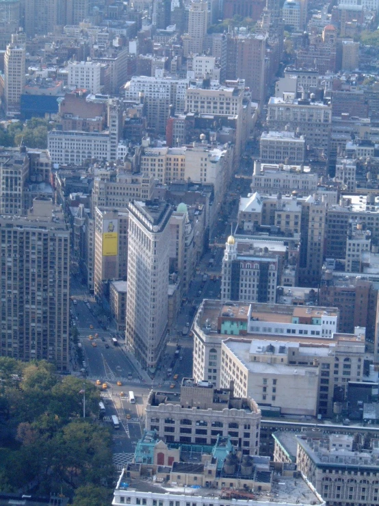 a city with very big buildings with blue roofs