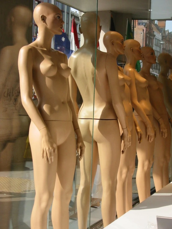 a display of womens  in front of glass