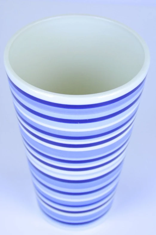an empty blue plastic cup on a white table