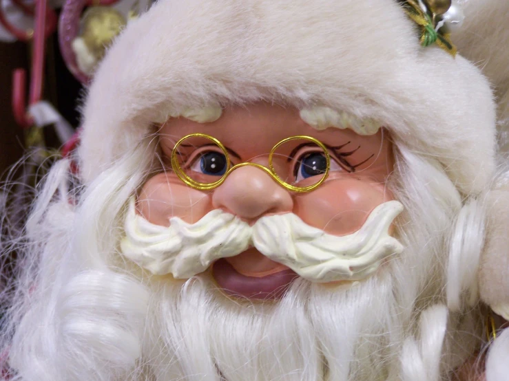 a santa clause is wearing eye glasses