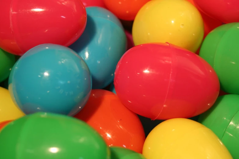 many bright colored balls are in a pile