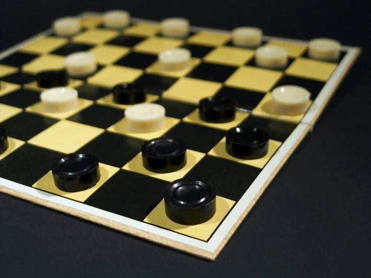 a close up of a chess board with pieces on it