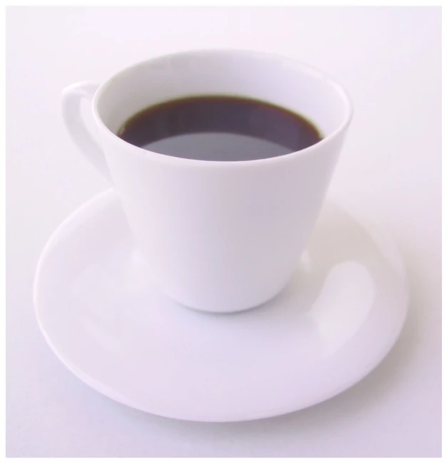 a cup of coffee is sitting on a saucer