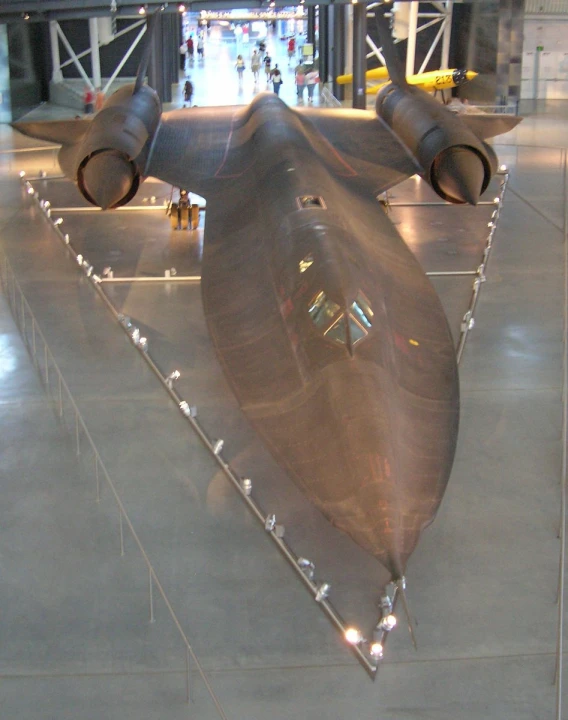 a plane being displayed in a museum for people