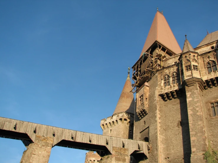 a building with a clock on the side and several walls around it