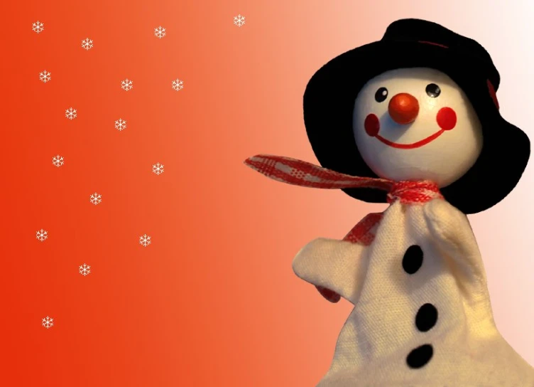 a snowman on red and pink is wearing a black hat, scarf, and dress