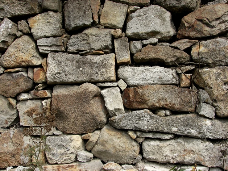 several large rocks stacked together to form a wall