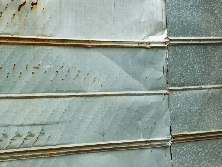 a rusted metal roof on a large building