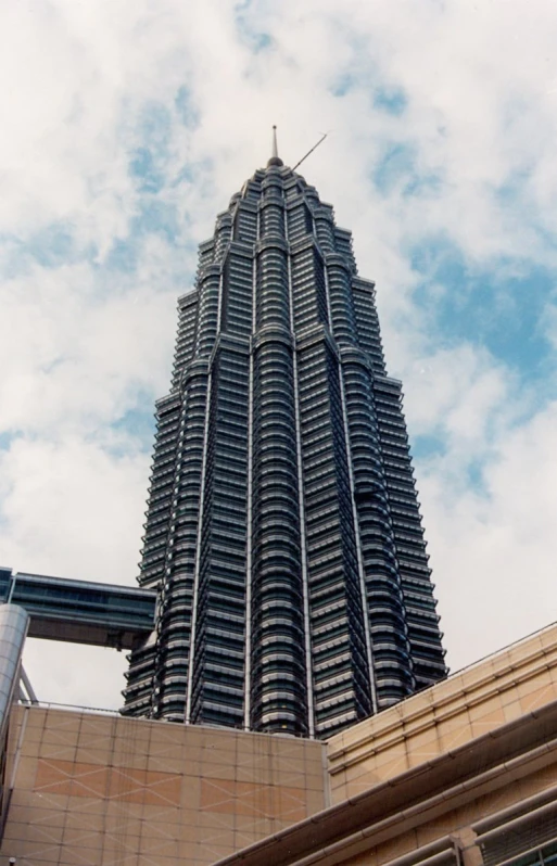 the side of a large building with a tall spire