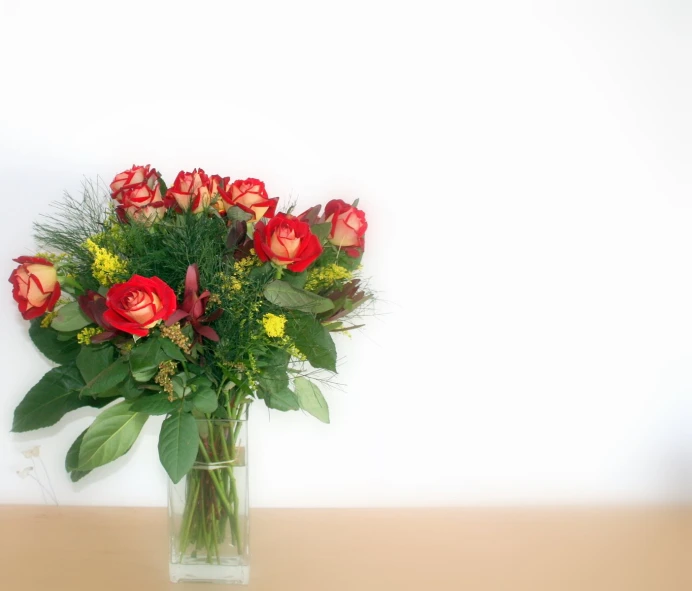 there is a vase filled with flowers on the table