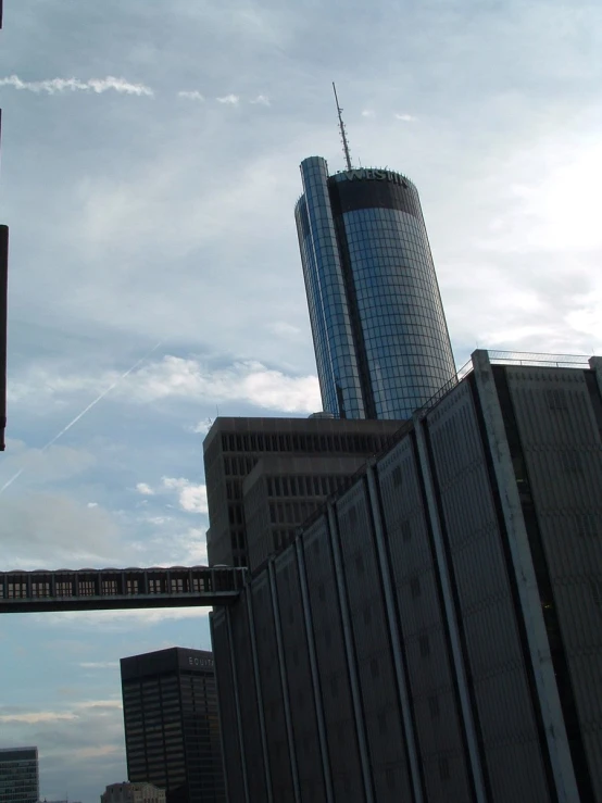 a very tall building sitting next to other tall buildings