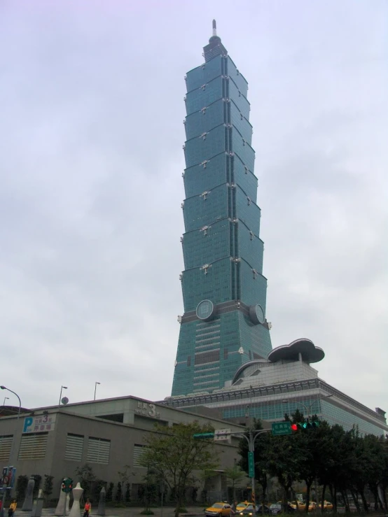 a skyscr building with large clocks on the side