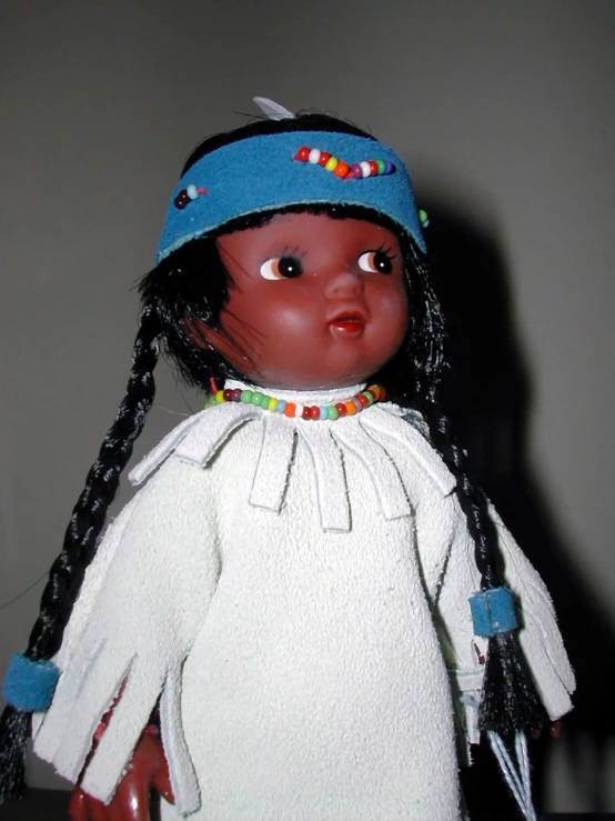 a girl doll that is wearing an outfit