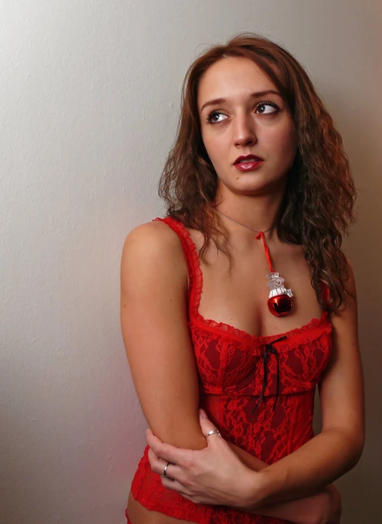 woman wearing a  and red lingerie posing for po