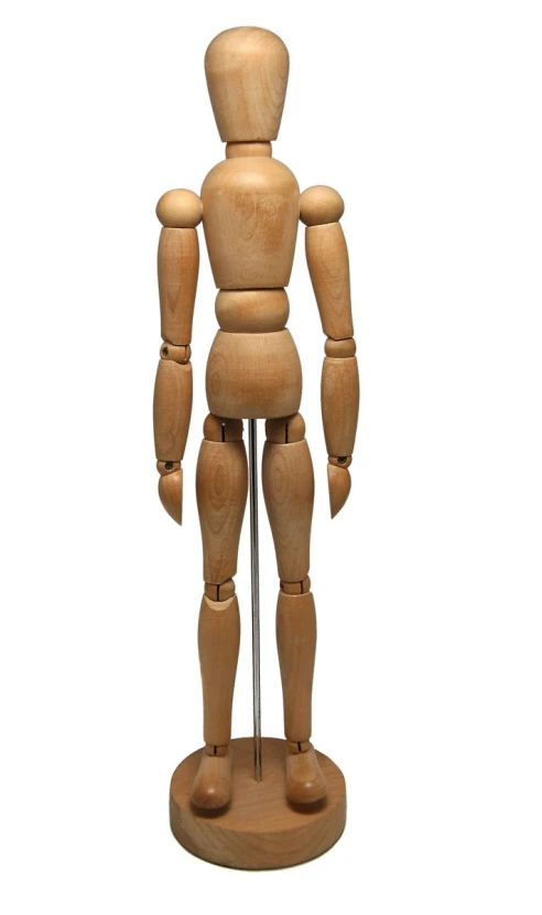 a wooden mannequin is on a wooden stand