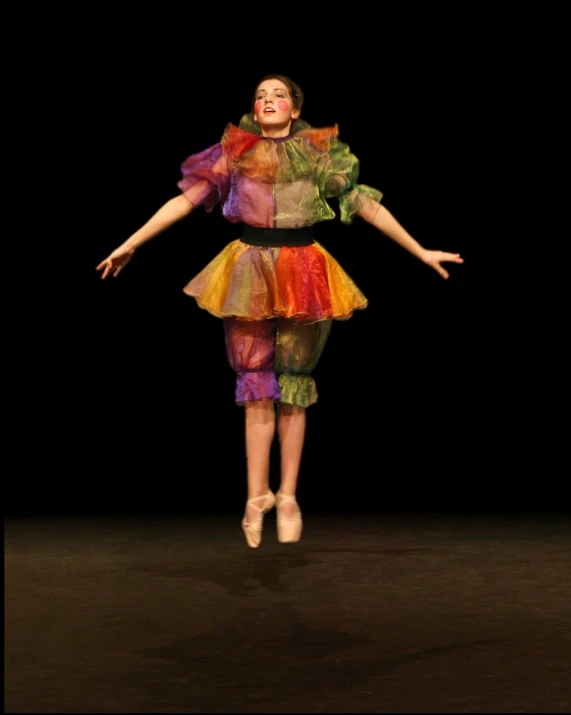 woman in dress and heels standing on stage