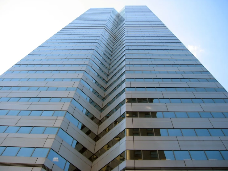 looking up at the top of a tall building