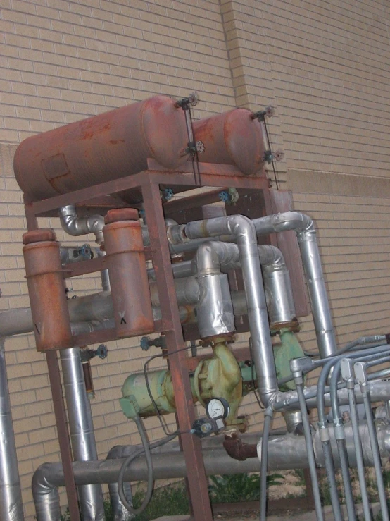 multiple pipes and valves are visible near a building