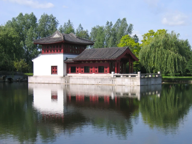 there is a pavilion on the water's edge