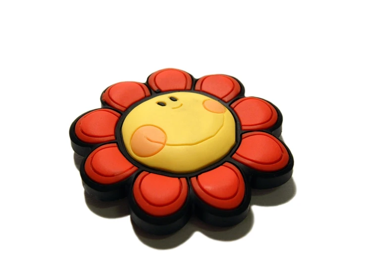 the smiling flower brooch is yellow with a red center