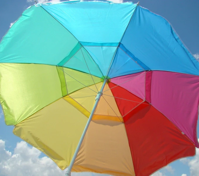 this umbrella is brightly colored, and is sitting in the air
