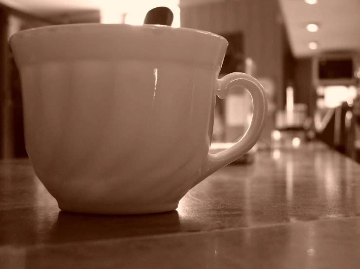 a coffee cup sitting on top of a counter