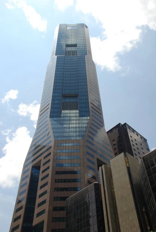 a high rise skyscr standing next to another building