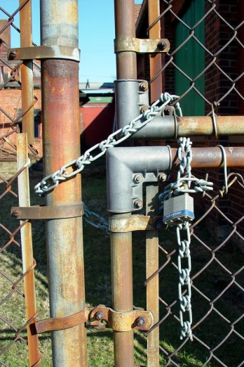 a chain is attached to a metal fence