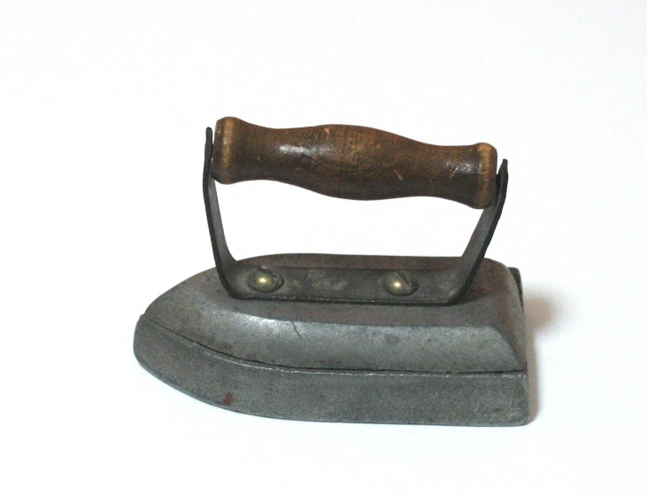 a small wooden handle on a iron