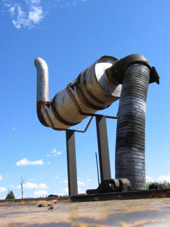 pipes that are sitting outside against a blue sky