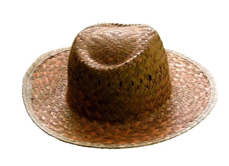 a large brown hat sitting on top of a white surface