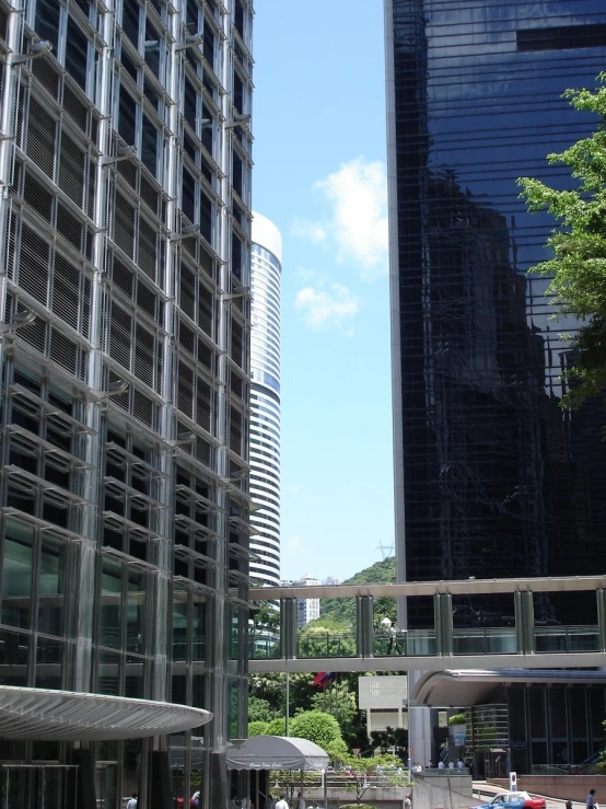 people sitting on benches in front of buildings