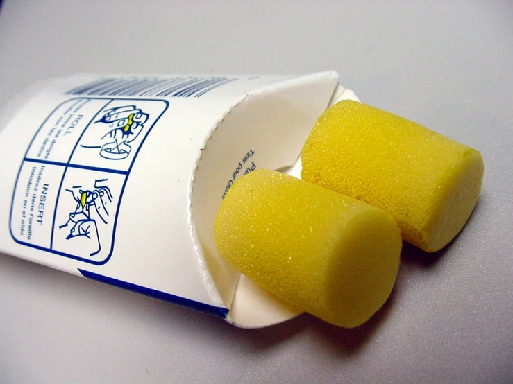 an opened carton of yellow candy flakes