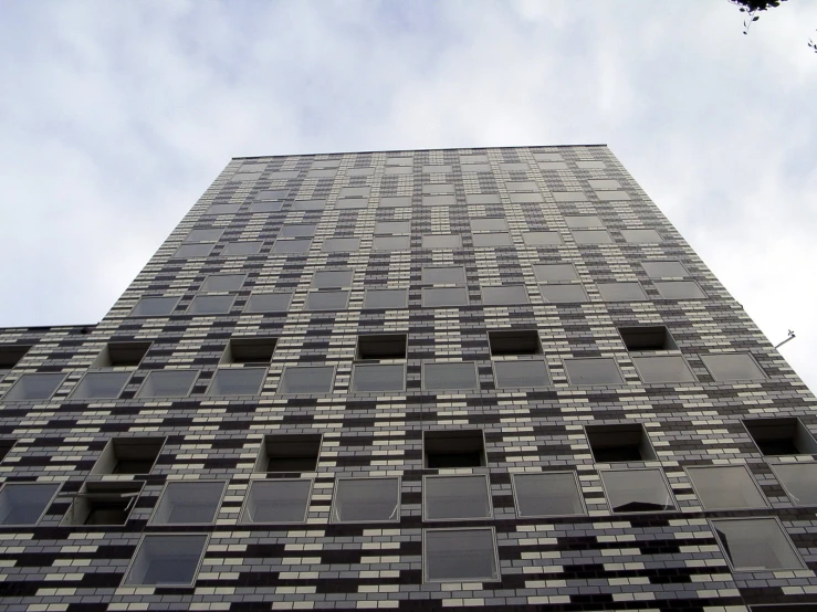 the tall building has black windows and black bars