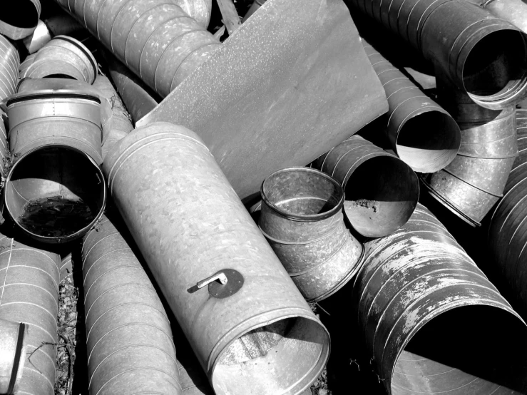 many different sized metal objects sitting on the floor