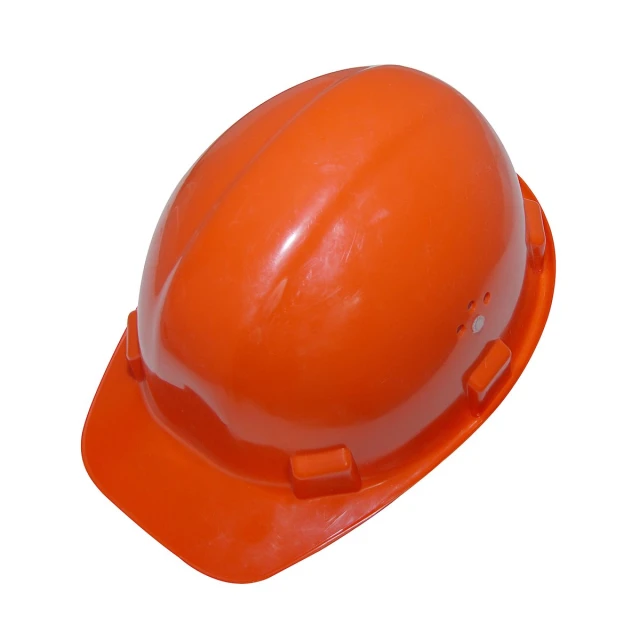 an orange hard hat on top of a white background