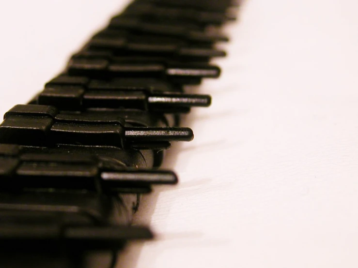 an image of many small metal bars that are lined up