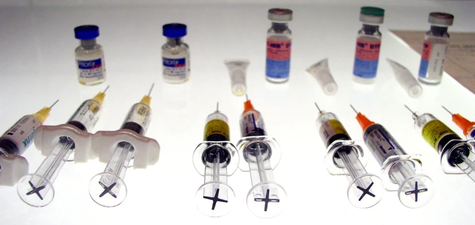 a group of small medical tubes lined up with vials