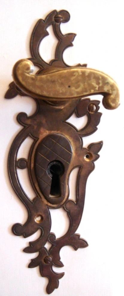 an antique antique door knock with a key