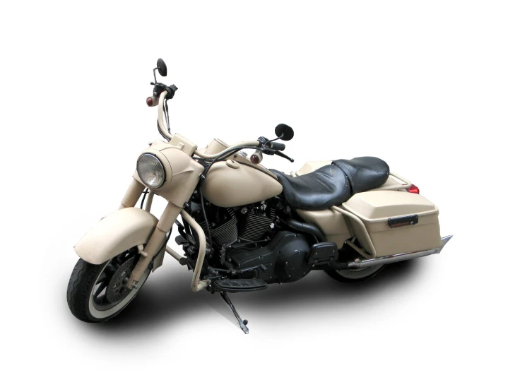 a tan motorcycle that is parked on a white background