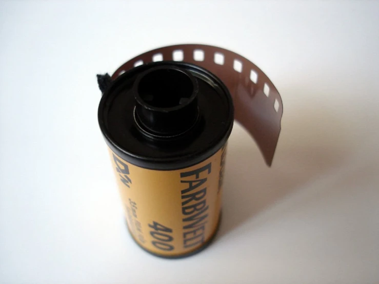 an old film is being used to attach a drink holder