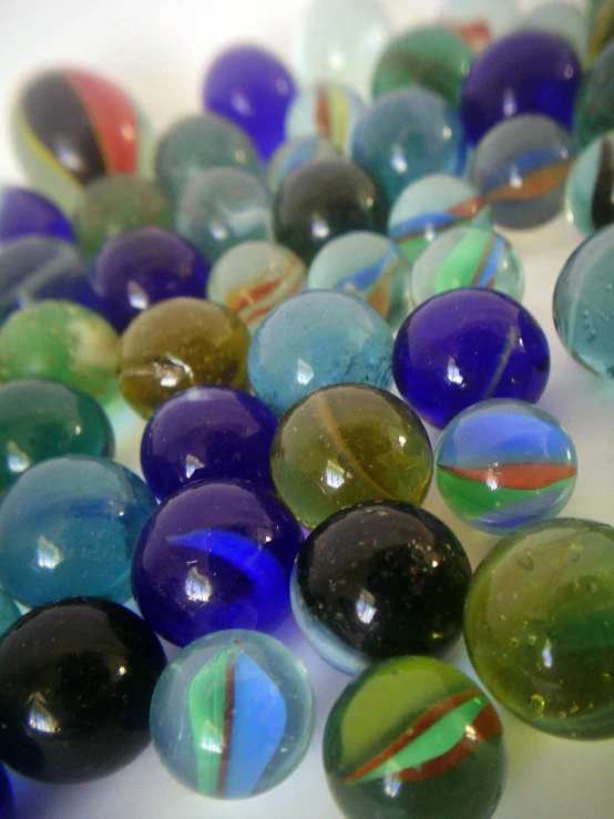 several round glass beads are scattered on the floor