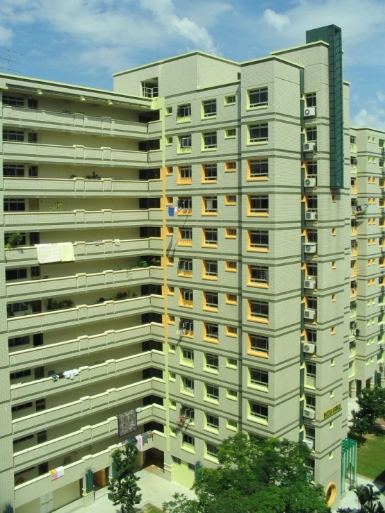 an old building stands among many parked cars