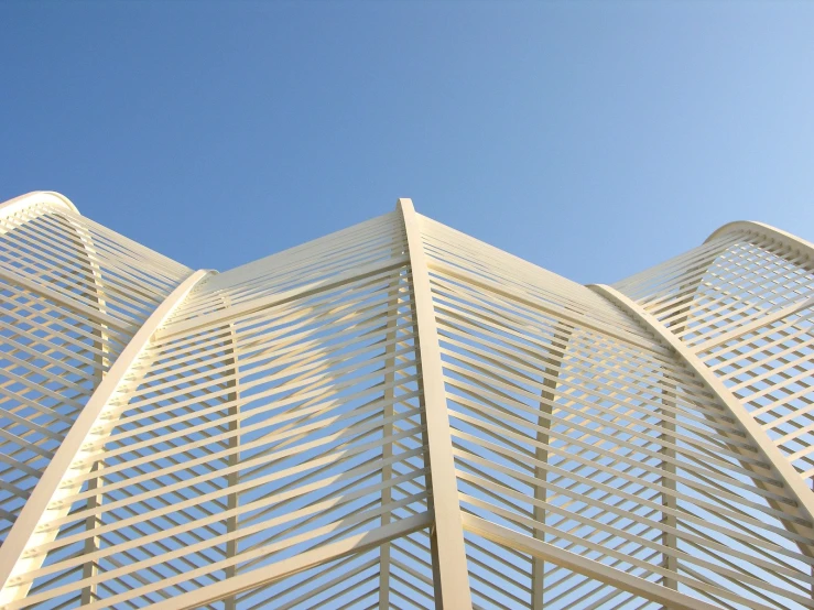 an architectural building is against the blue sky