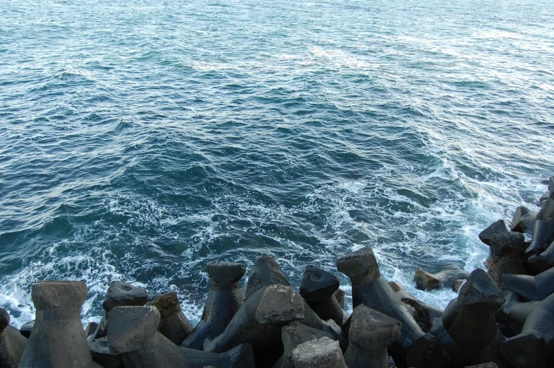 water flows over the top of some rocks