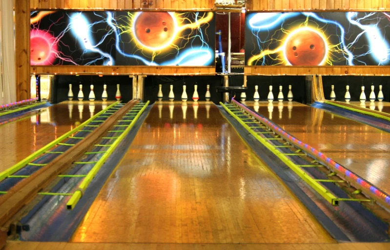 bowling alley with lanes and bowling balls on them